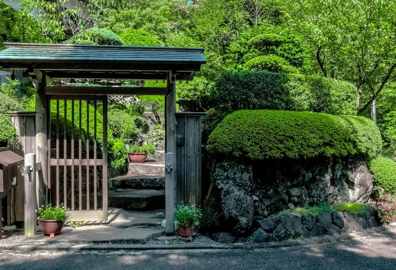 Stone wall natural wood arbor Newburyport ma gardening landscaping