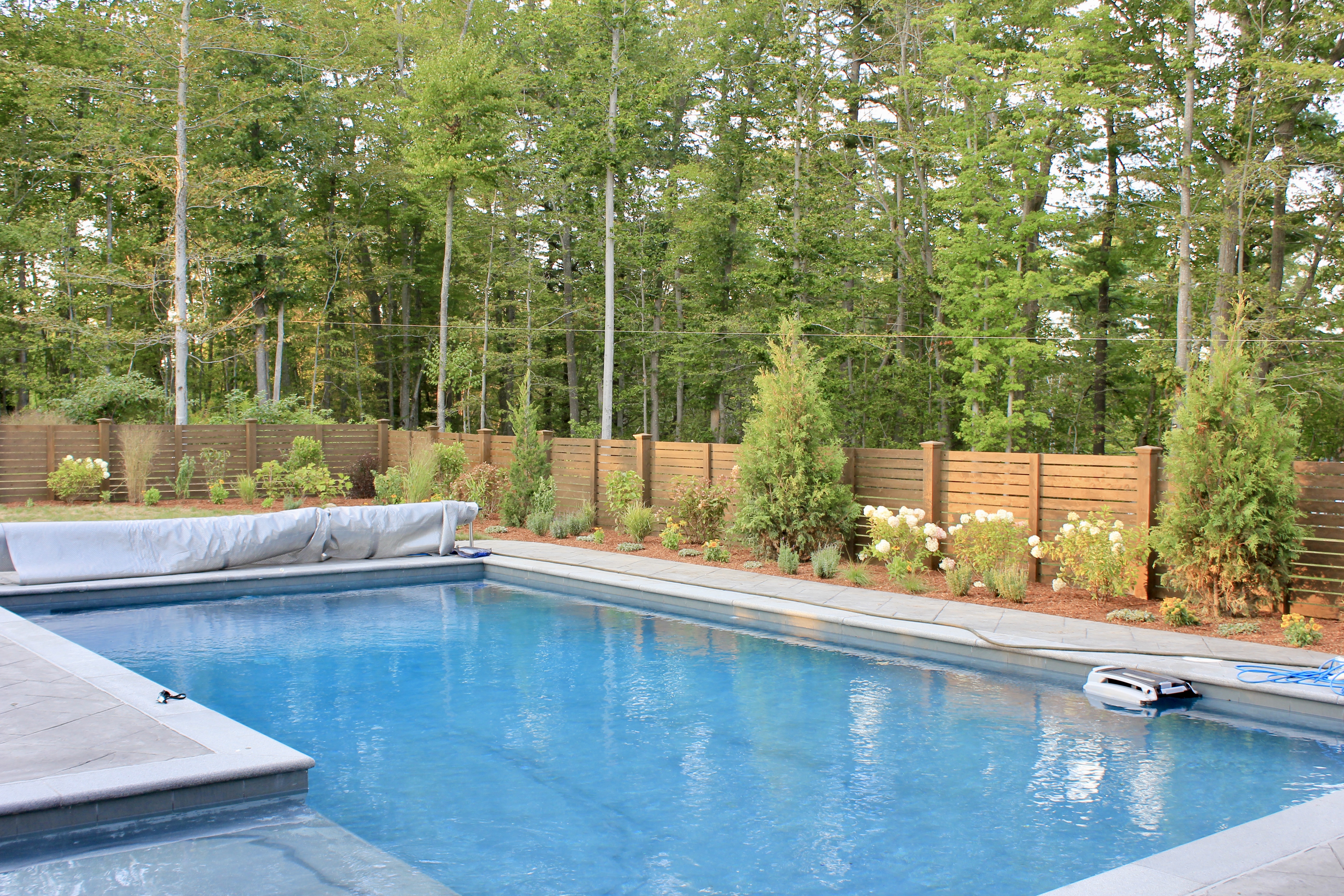 Custom design in Newburyport Ma poolside garden with brick patio and perennials
