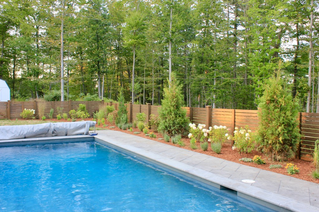 Custom design in Newburyport Ma poolside garden with brick patio and perennials