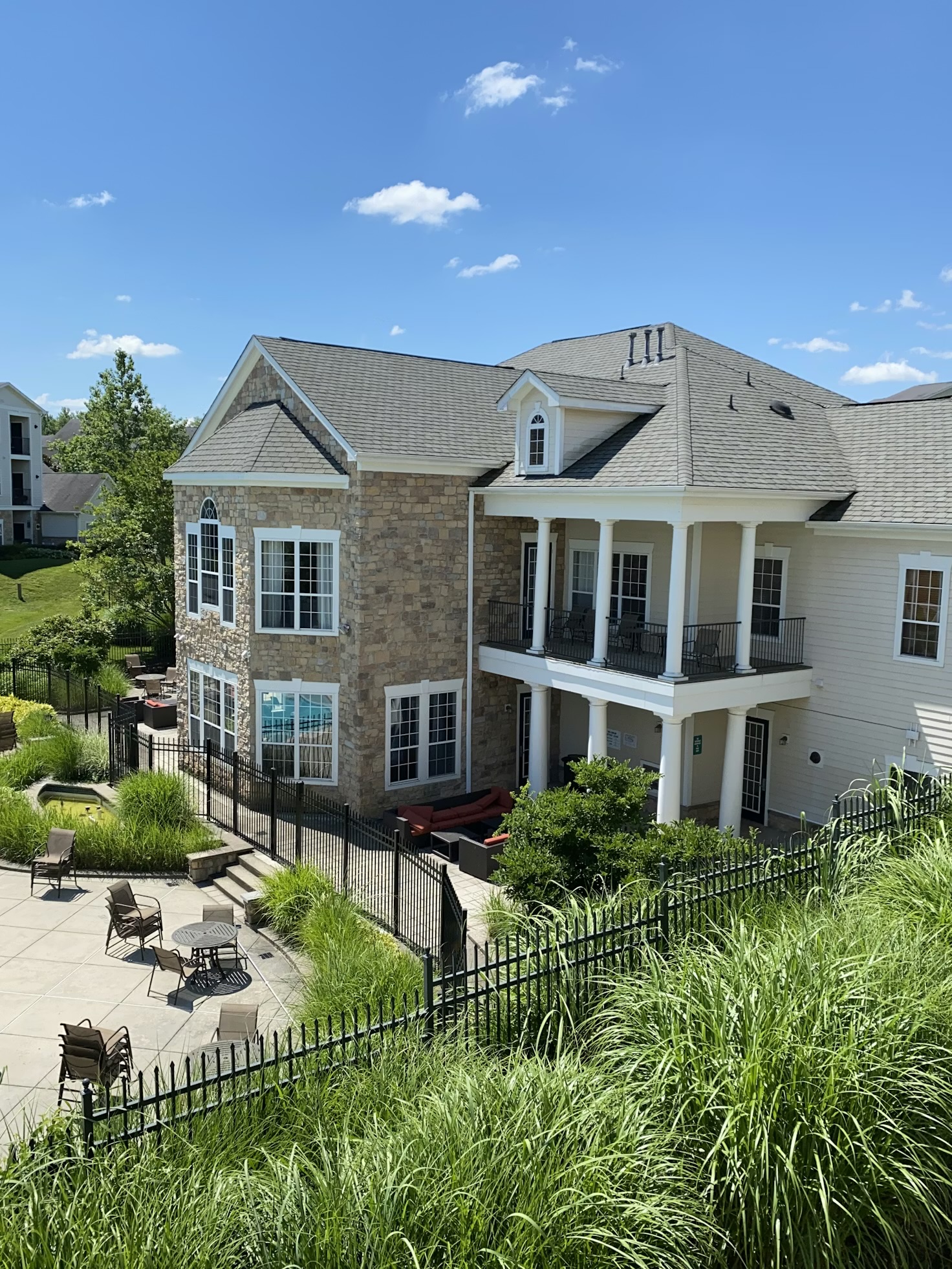 Modern home Andover ma with pool side planting and hardscape landscape design and construction