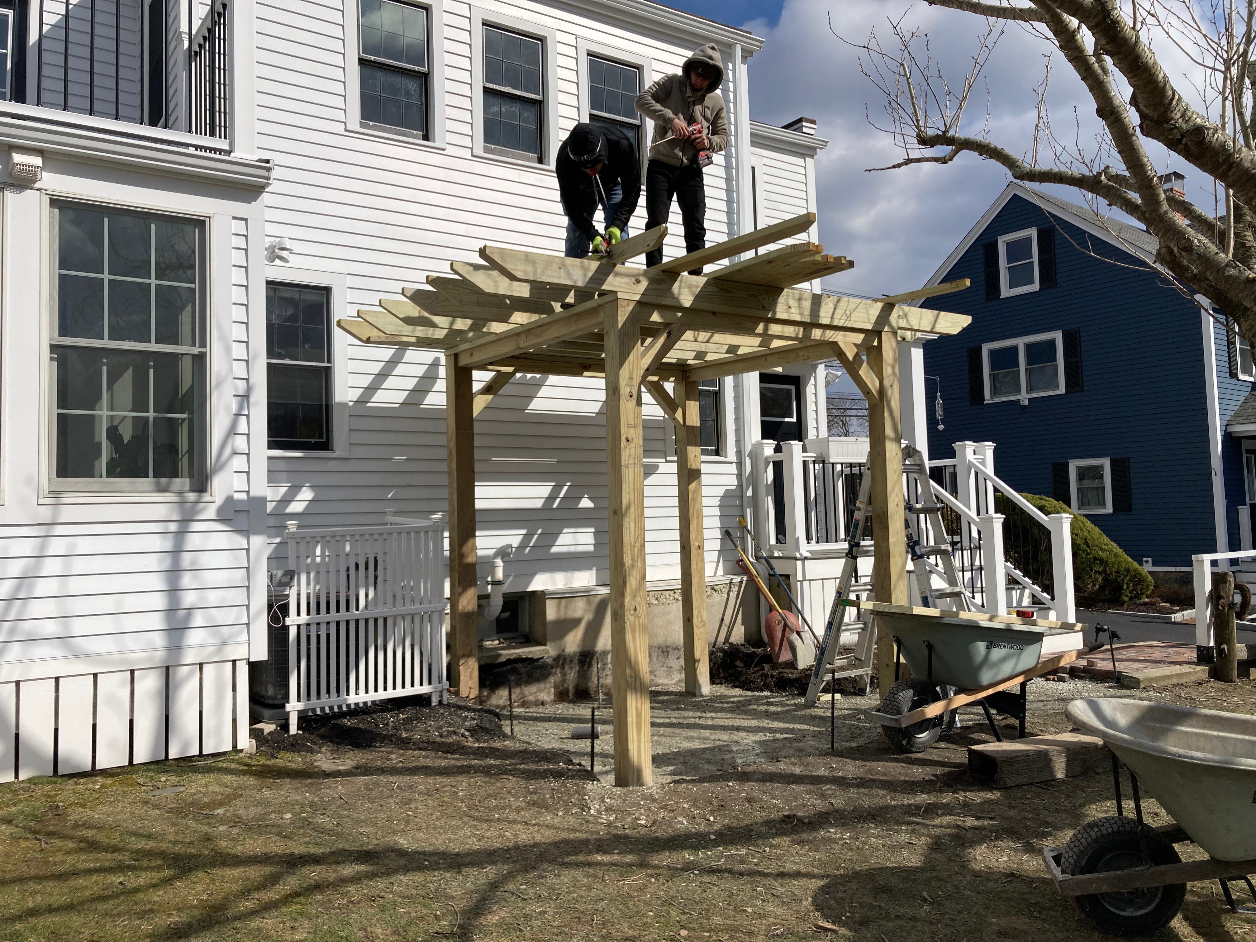 Pergola woodworking custom built small space backyard patio Newbury ma jmj gardens hardscape masonry