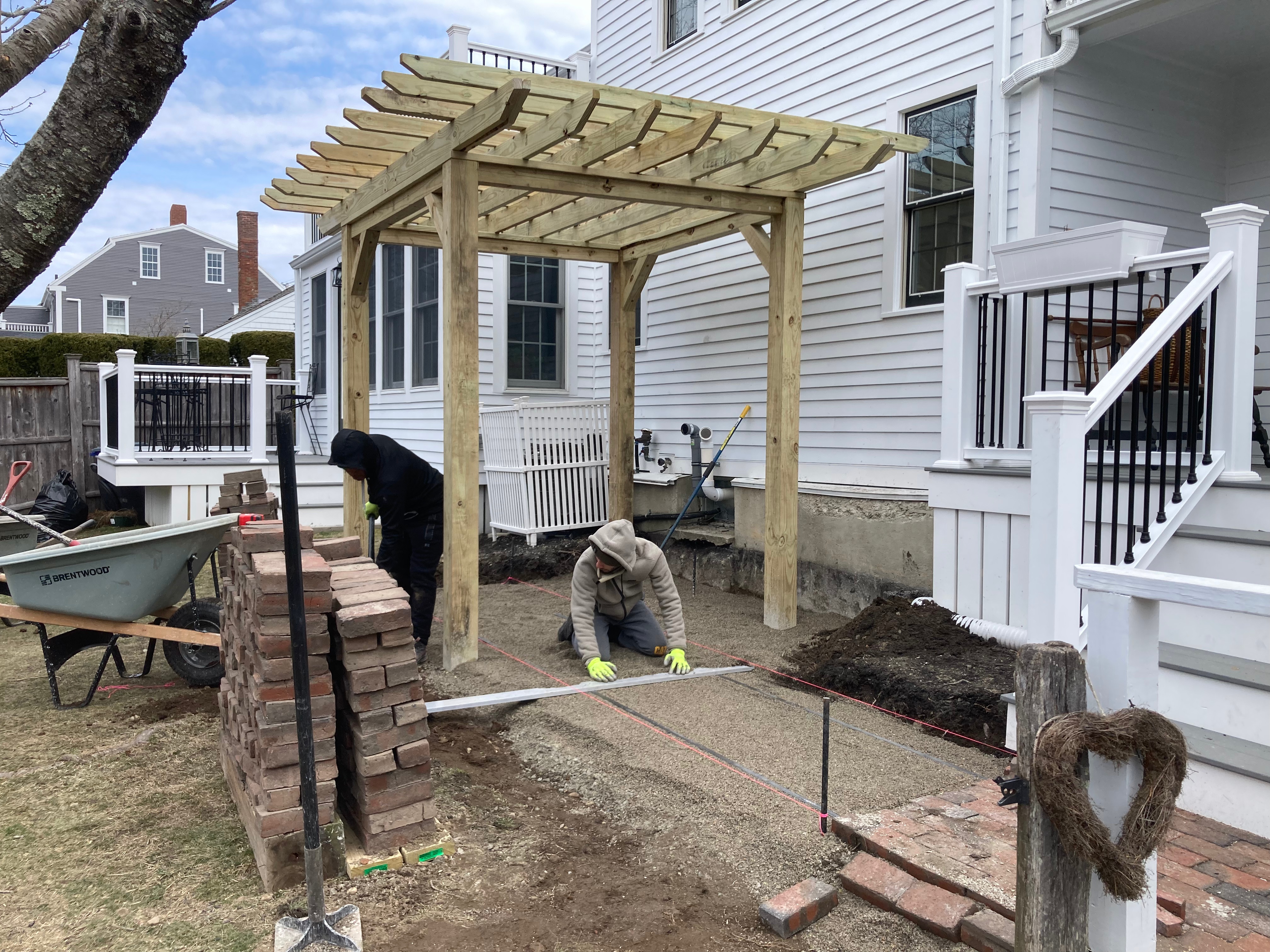 Pergola woodworking custom built small space backyard patio Newbury ma jmj gardens hardscape masonry