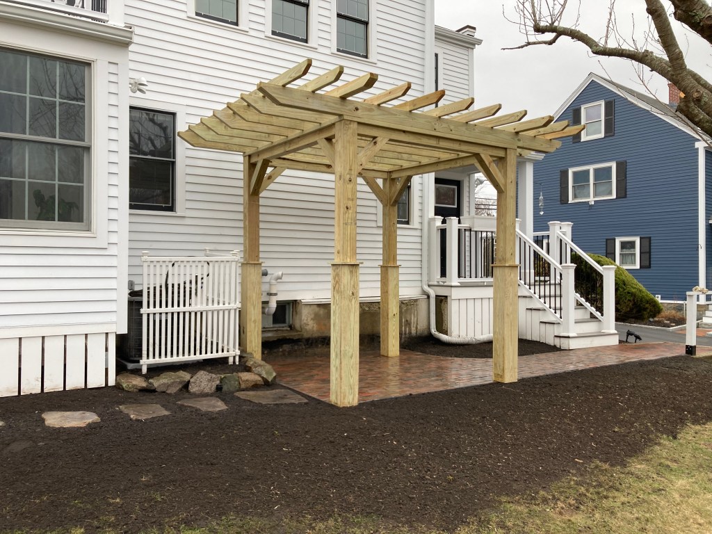 Pergola woodworking custom built small space backyard patio Newbury ma jmj gardens hardscape masonry